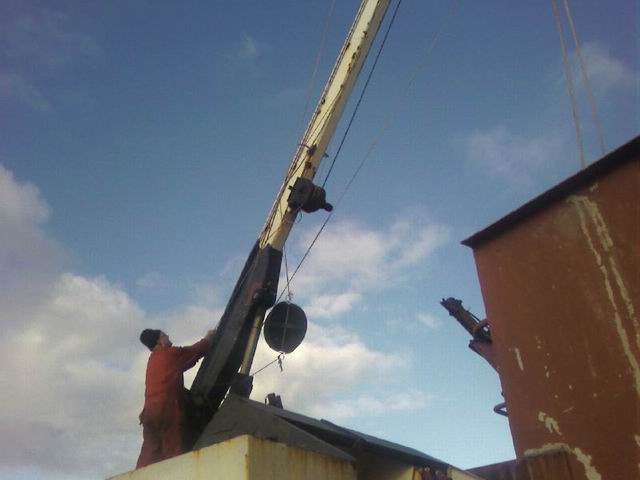 Control system for a crane on a barge